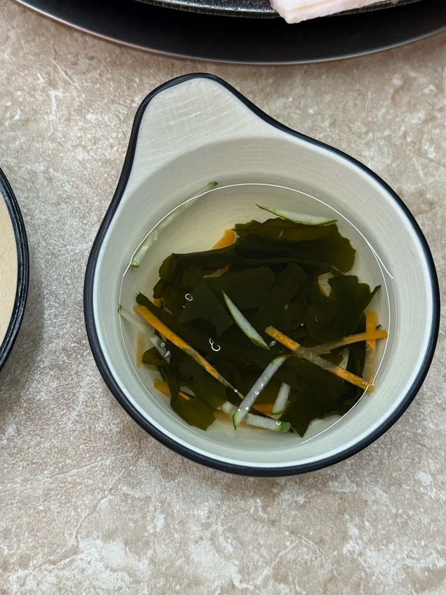 Side dish plates set alongside the jjukkumi