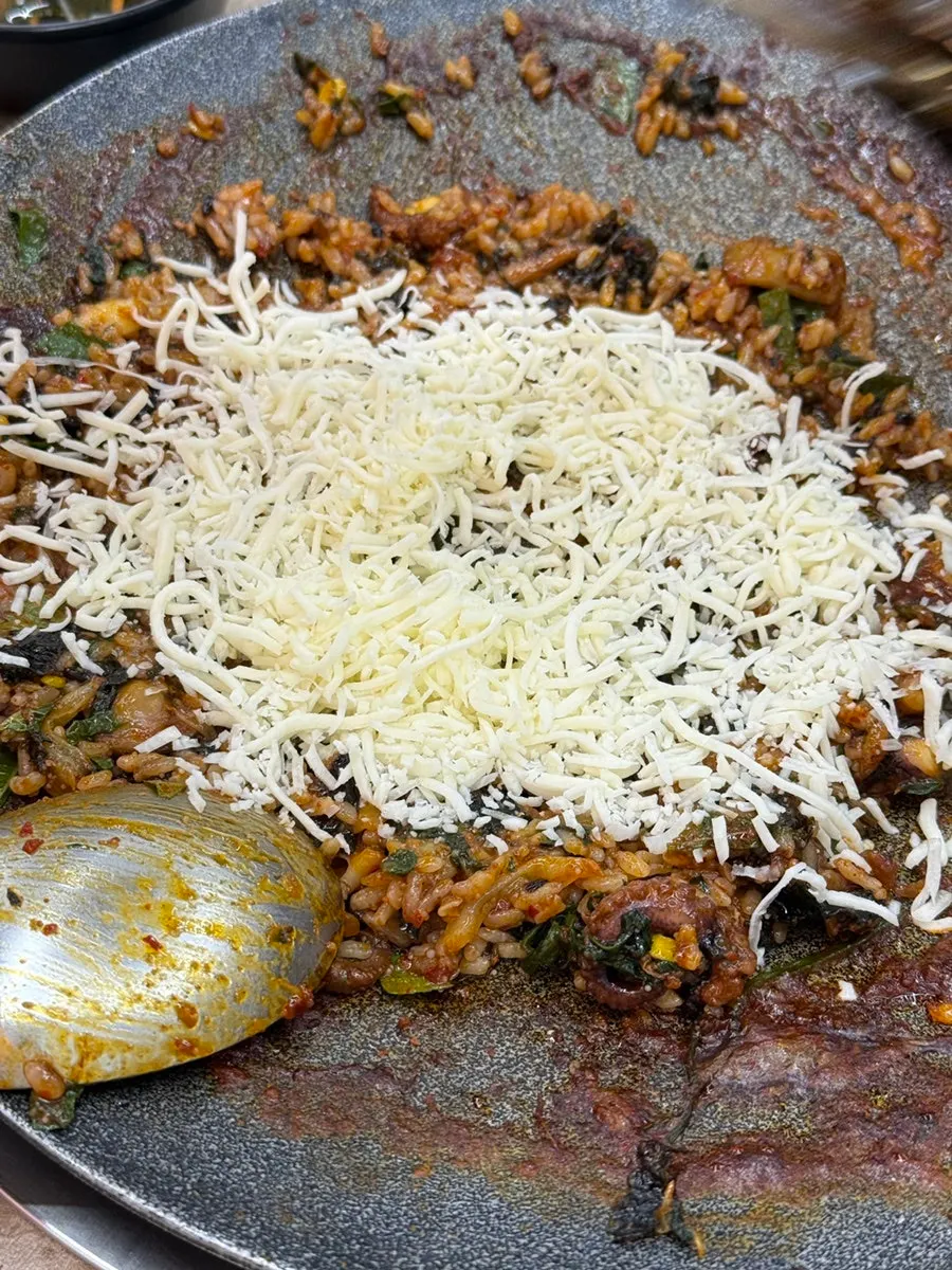Spicy hotplate jjukkumi eaten with rice