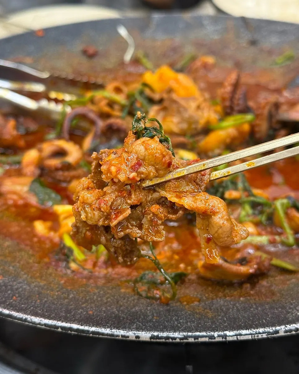 Poured garlic corn cheese in a cast-iron pan