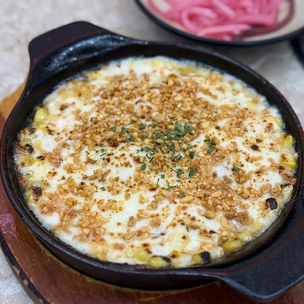 Close-up of plump corn kernels in the garlic corn cheese