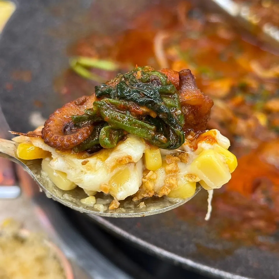 Sesame leaf wrap with jjukkumi, flying fish roe, and corn cheese