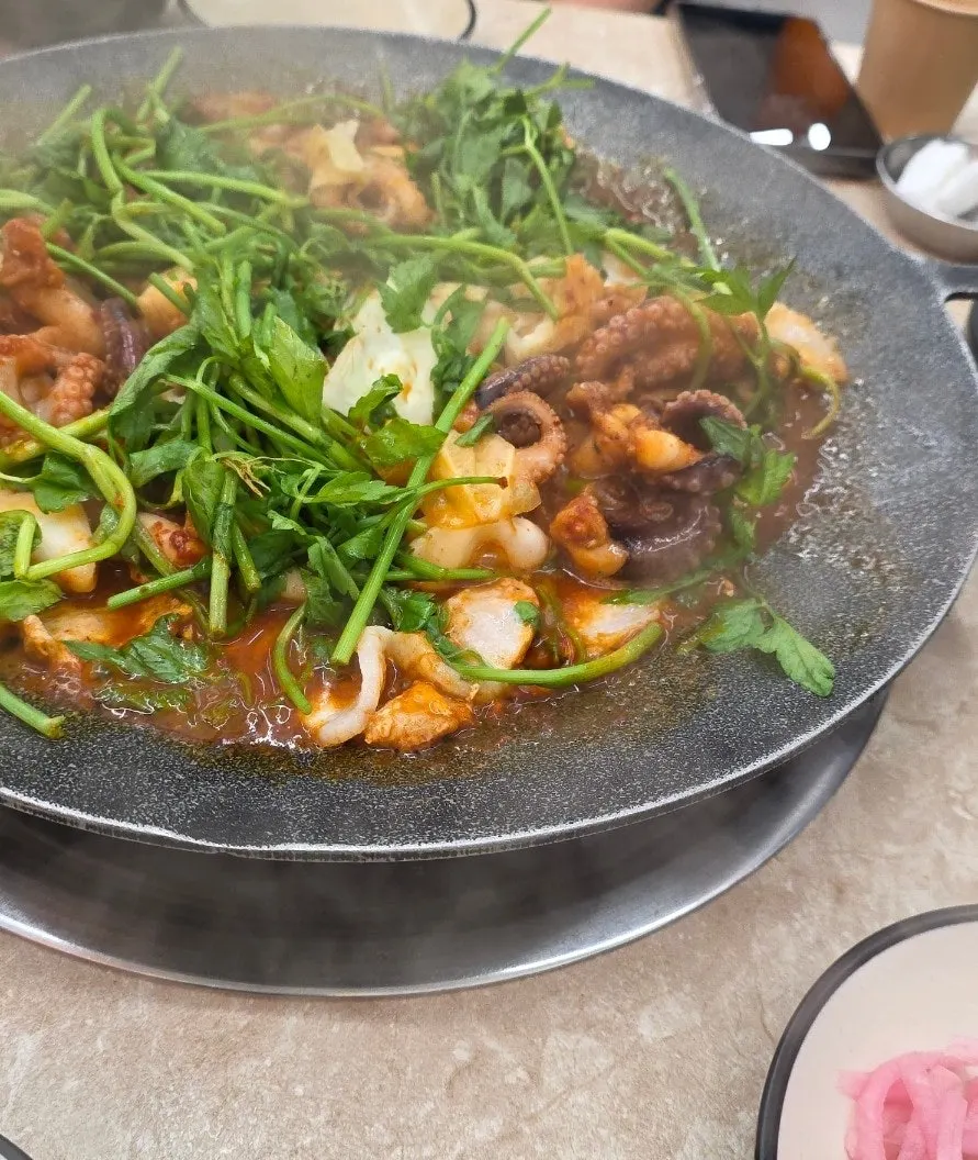 Black pork belly served alongside the jjukkumi
