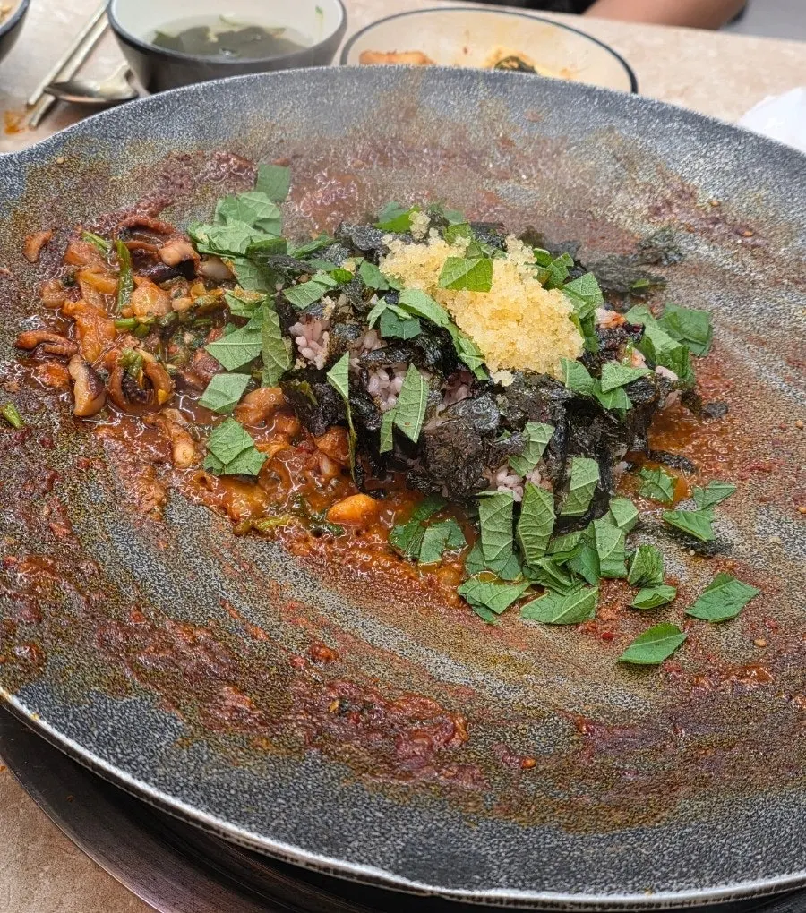 Wrapping black pork belly into a bite