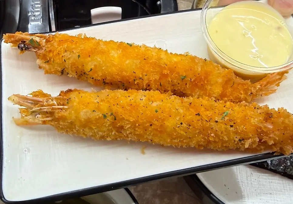 Two king prawn fritters that were added on