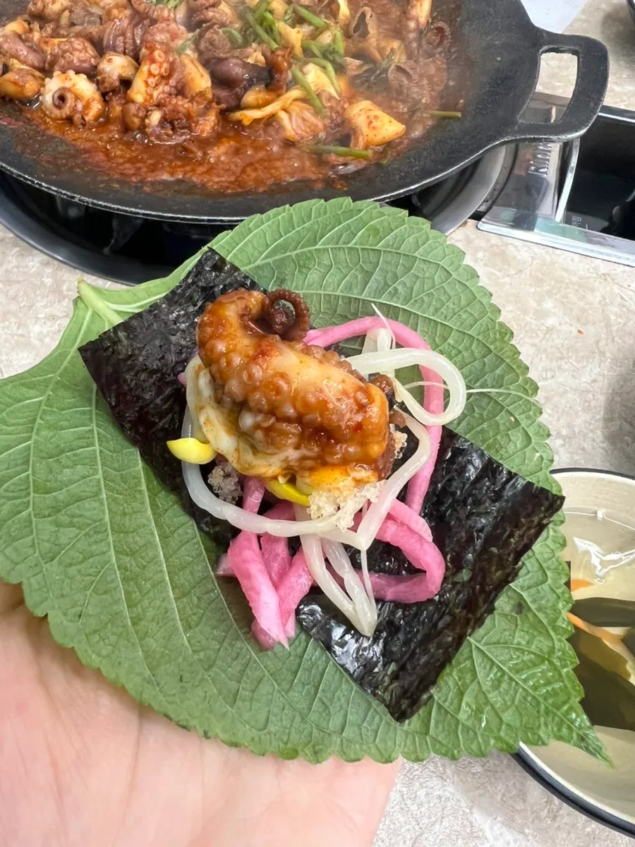 Jjukkumi wrap topped with flying fish roe