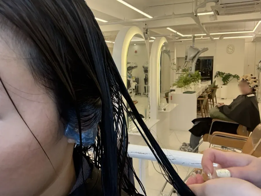 Clinic product being applied to the hair