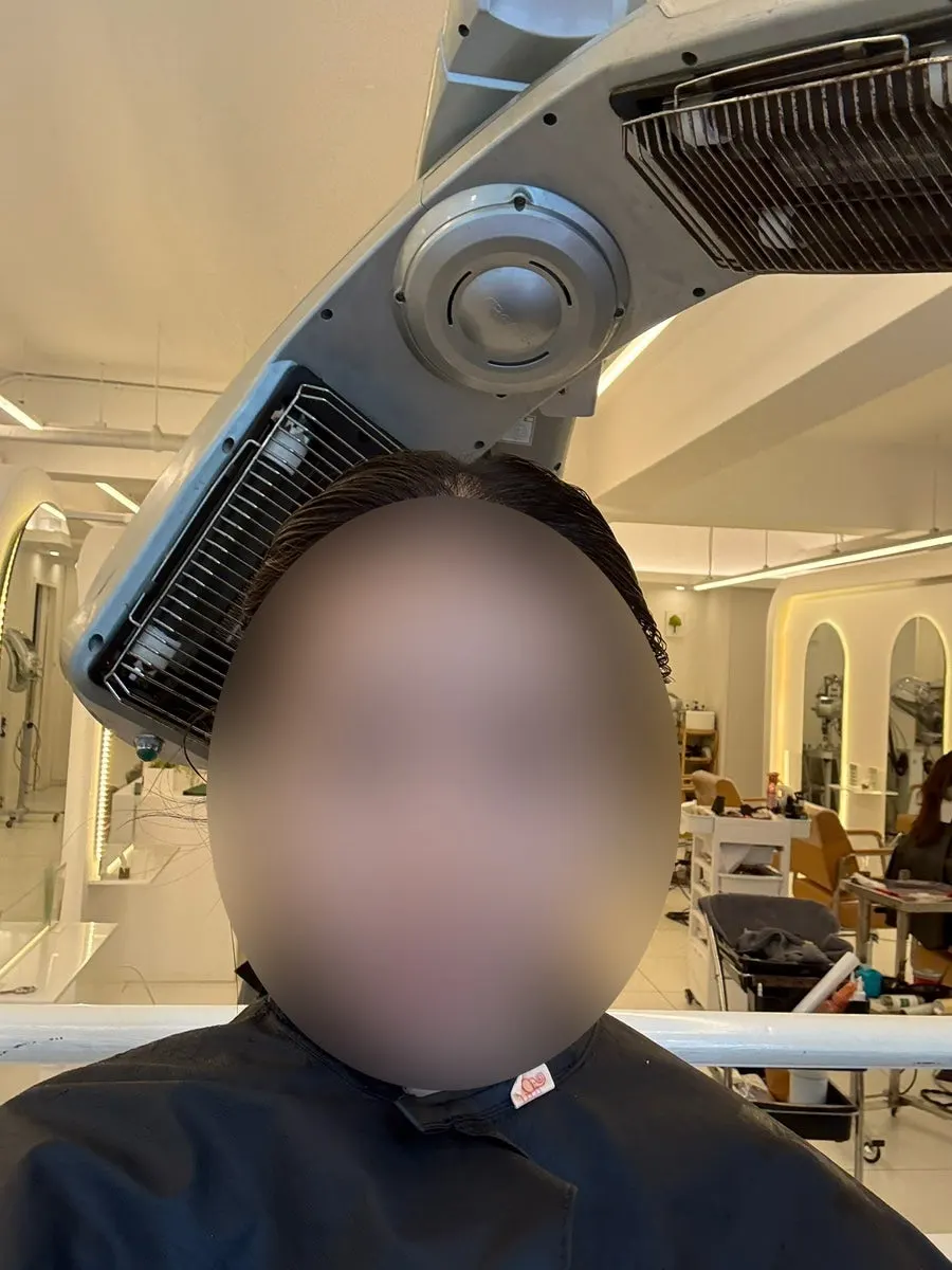 Hair undergoing keratin protein treatment