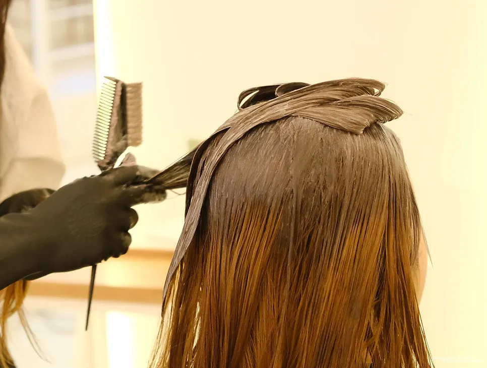 Dyed hair sections with styling tools
