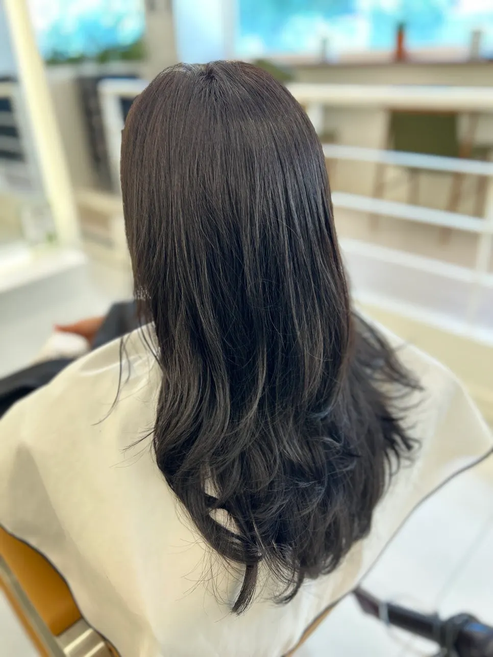 The head designer personally handling the hair