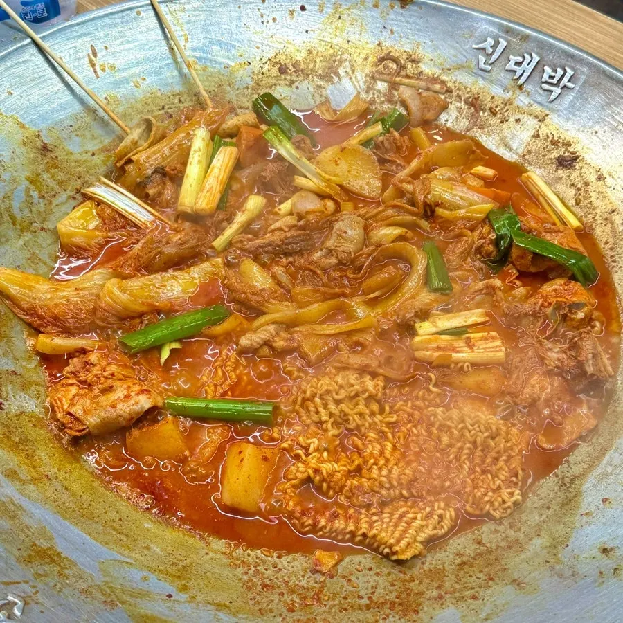 Cast-iron chicken stew simmering with added ramyeon noodles