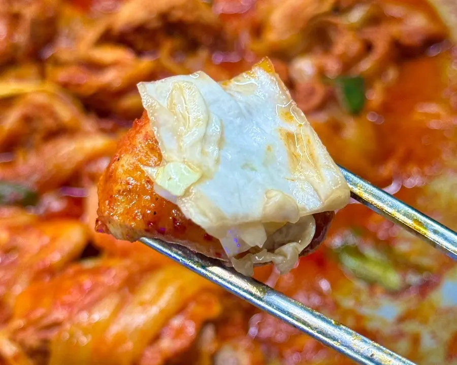 Chicken stew meat topped with white kimchi