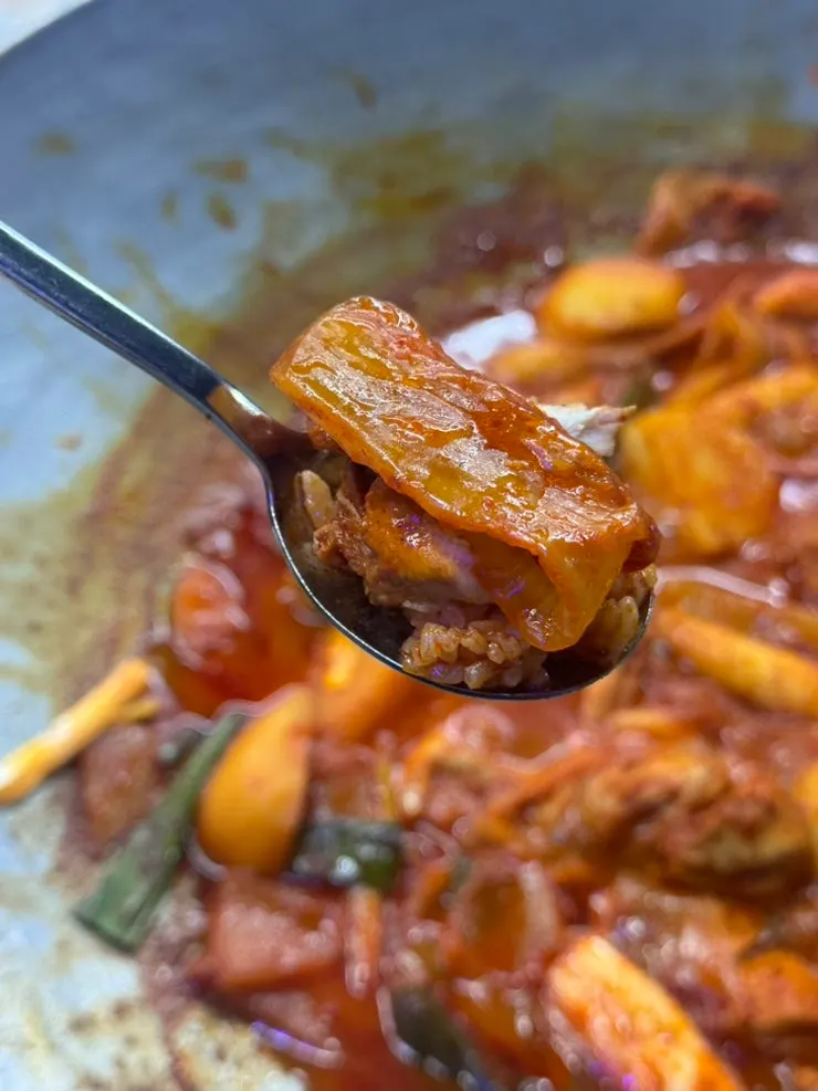 Chicken and kimchi soaked in seasoning