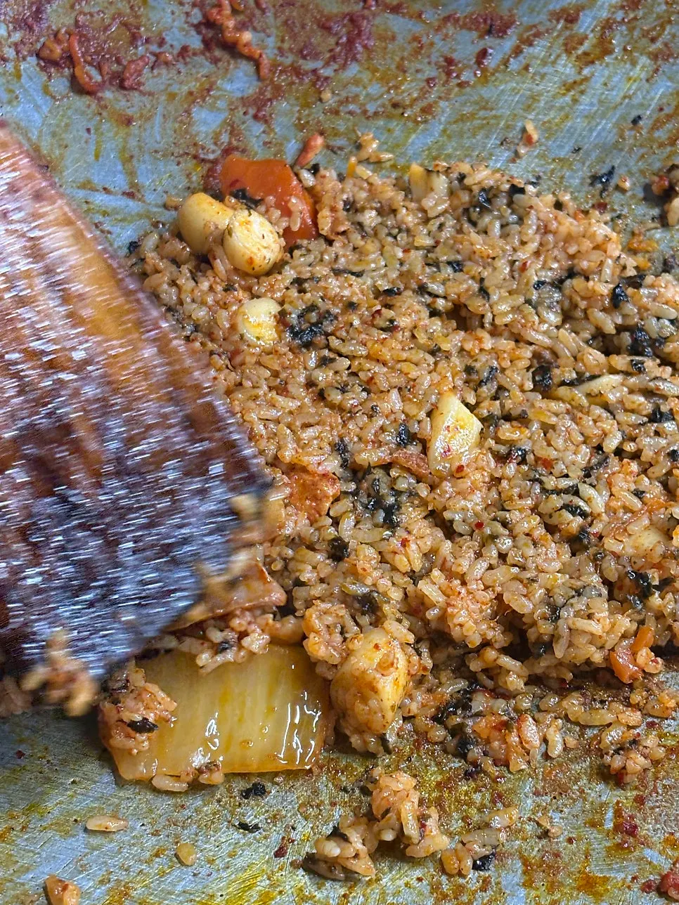 Chicken stew fried rice topped with extra cheese