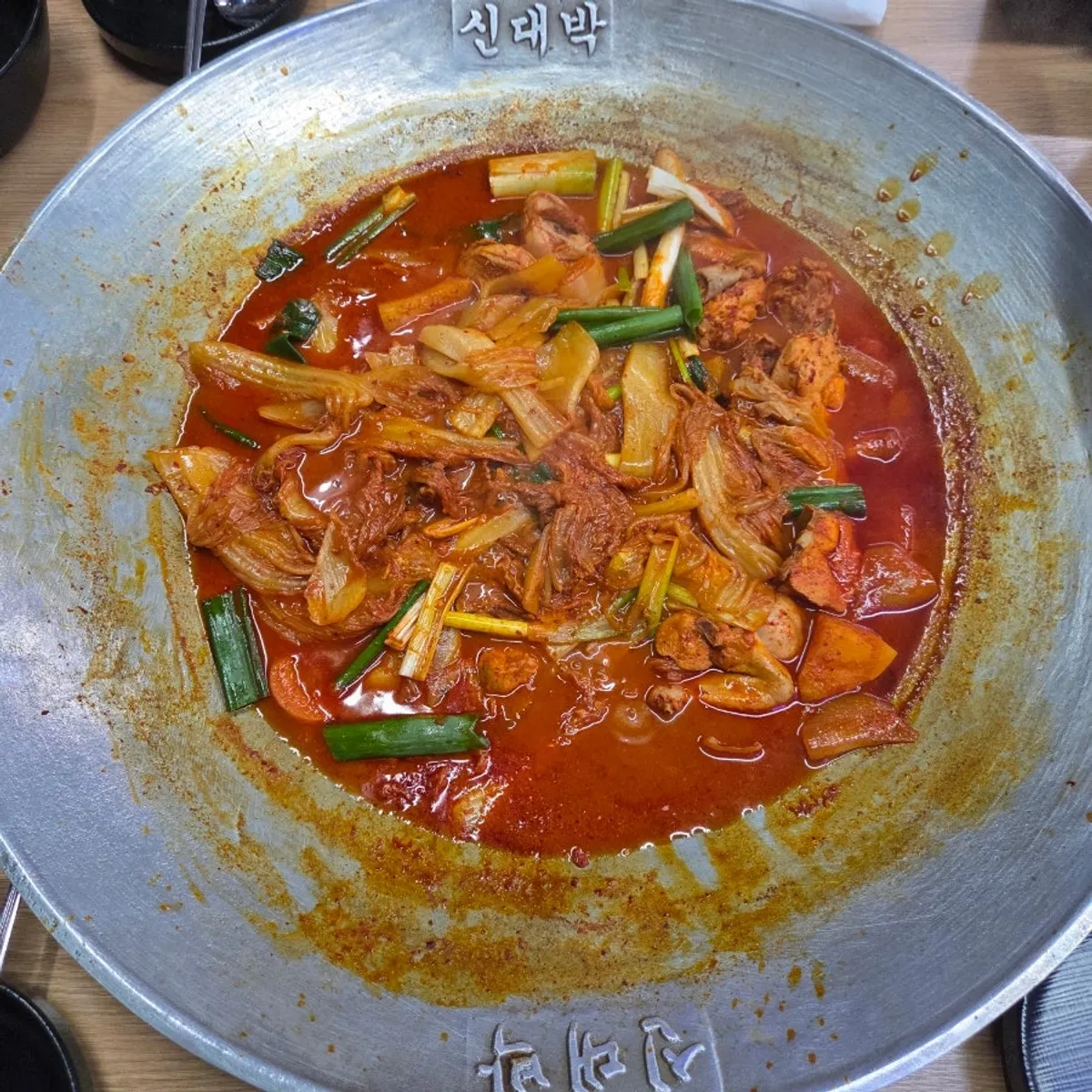 Cast-iron chicken stew with aged kimchi cut and prepared