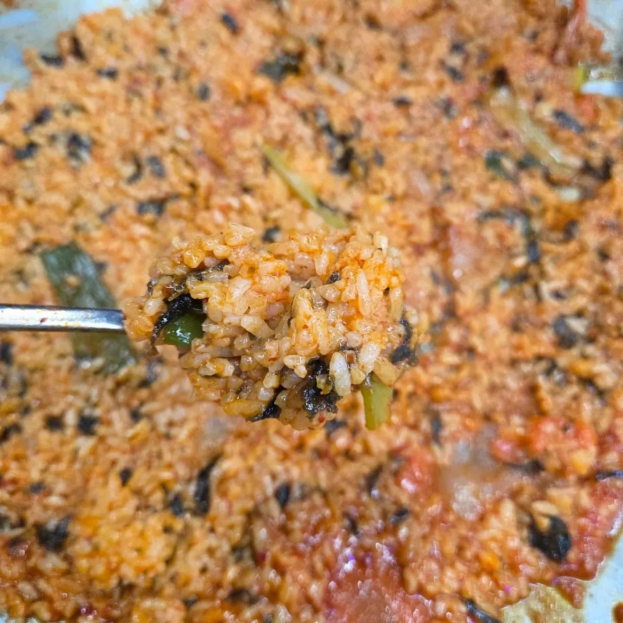 A spoonful of chicken stew fried rice