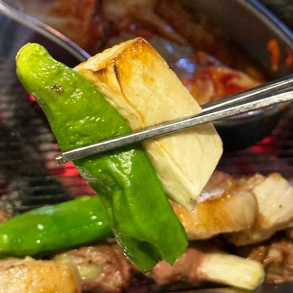 A bite of pork belly wrapped in lettuce