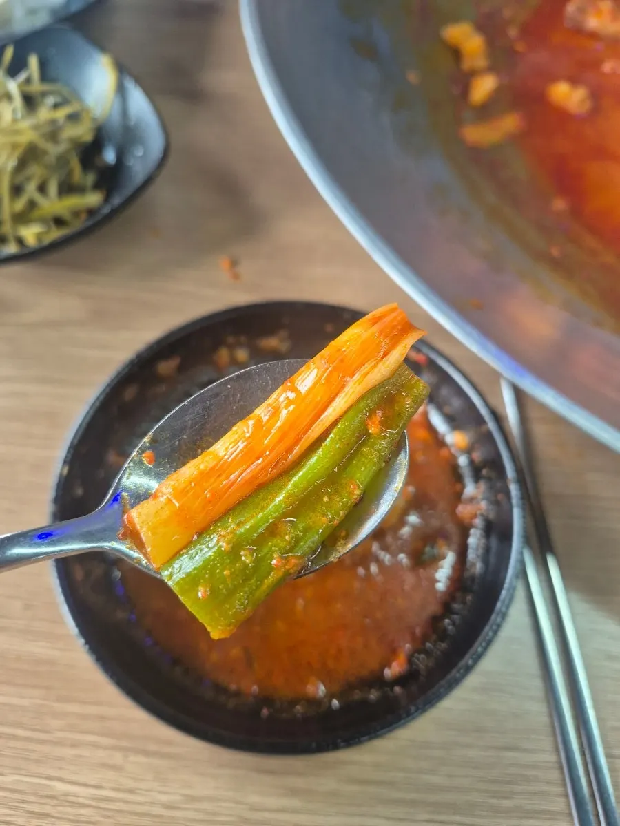 The cast-iron chicken stew for two near the end of the meal