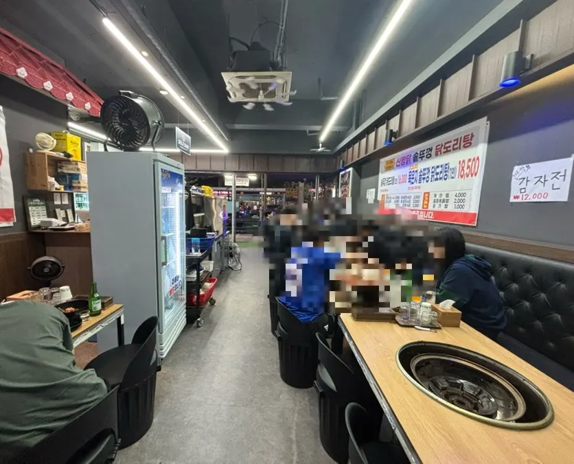 Dining hall with inner seating and wall signage visible