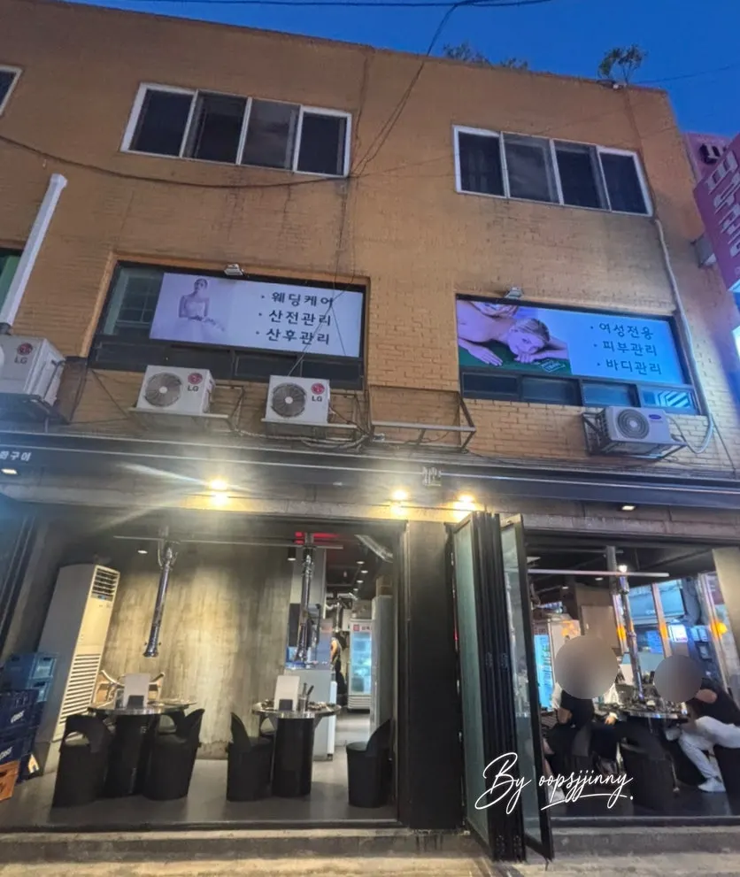 View of the restaurant with tables and grills