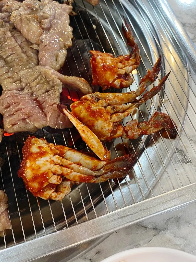 Close-up of ribs cooking over charcoal