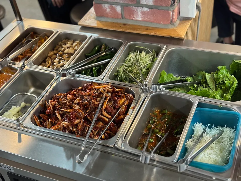 Scallion salad, aged kimchi, pickled onion and other side dishes for galbi