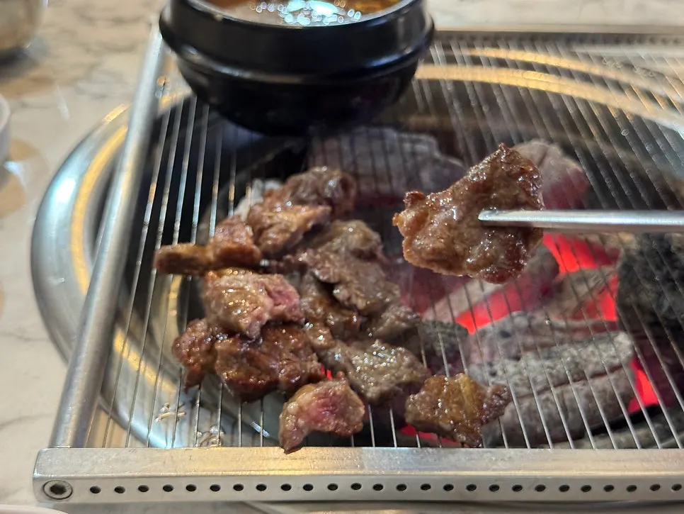 Fresh short rib grilling over charcoal