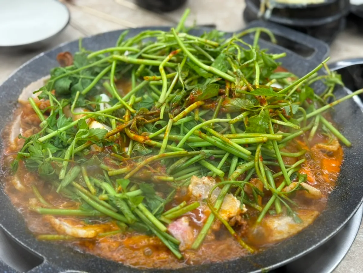 Jjukumi eaten as a flying-fish roe wrap