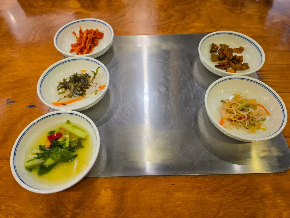 Table setting with basic banchan like seasoned bellflower root and mung bean jelly