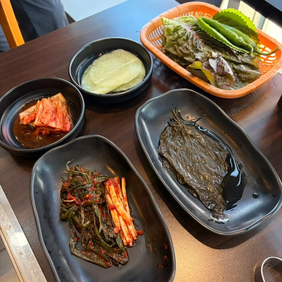 Cold cucumber soup, green onion kimchi and other basic sides at Yuil Jangeo