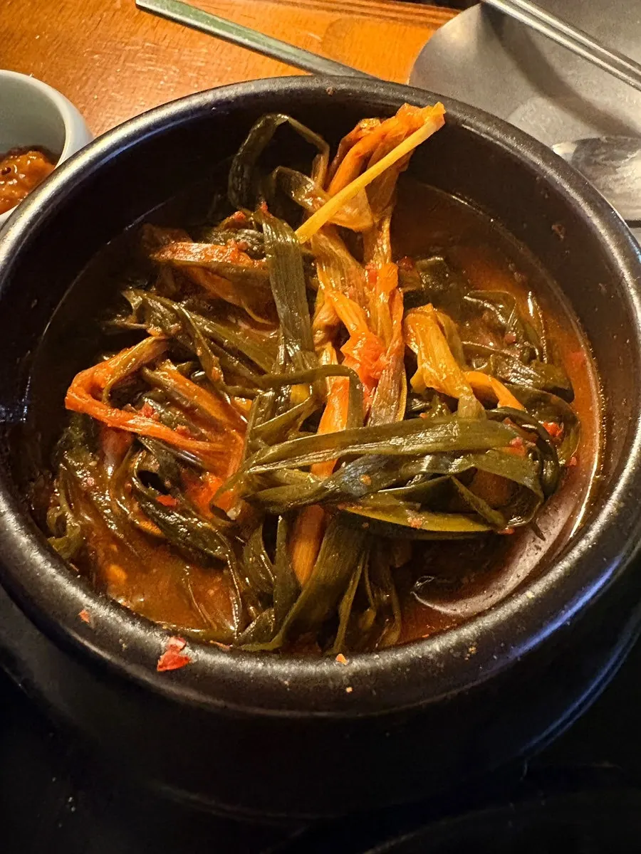 Signature pa-kimchi topped with meat, served complimentary