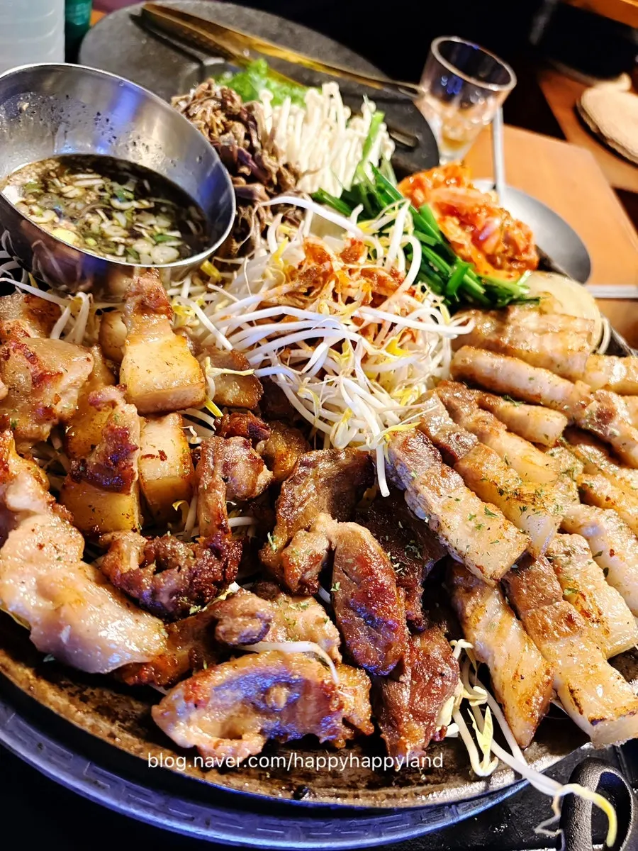 Kimchi and chive salad added on top of the meat on the grill