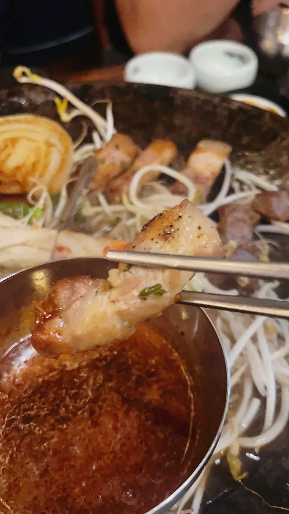 A bite of meat enjoyed at Gwangseonjip