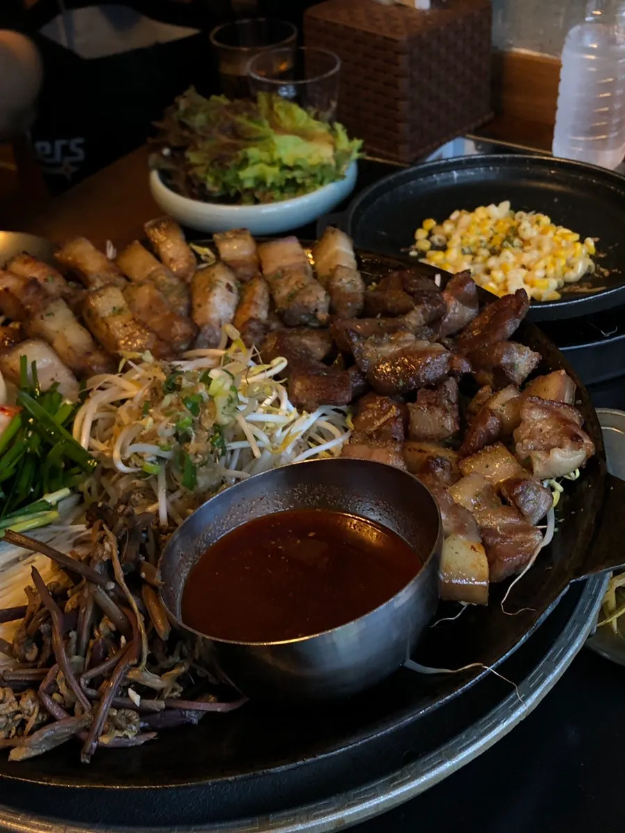 Close-up of mixed platter meat and side vegetables