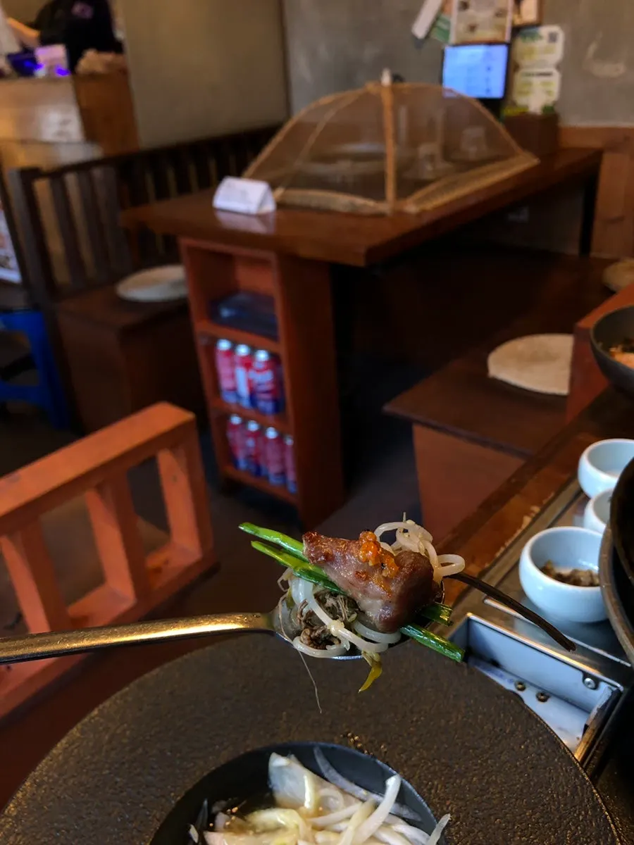 Plate of specialty cuts with smoky charcoal aroma