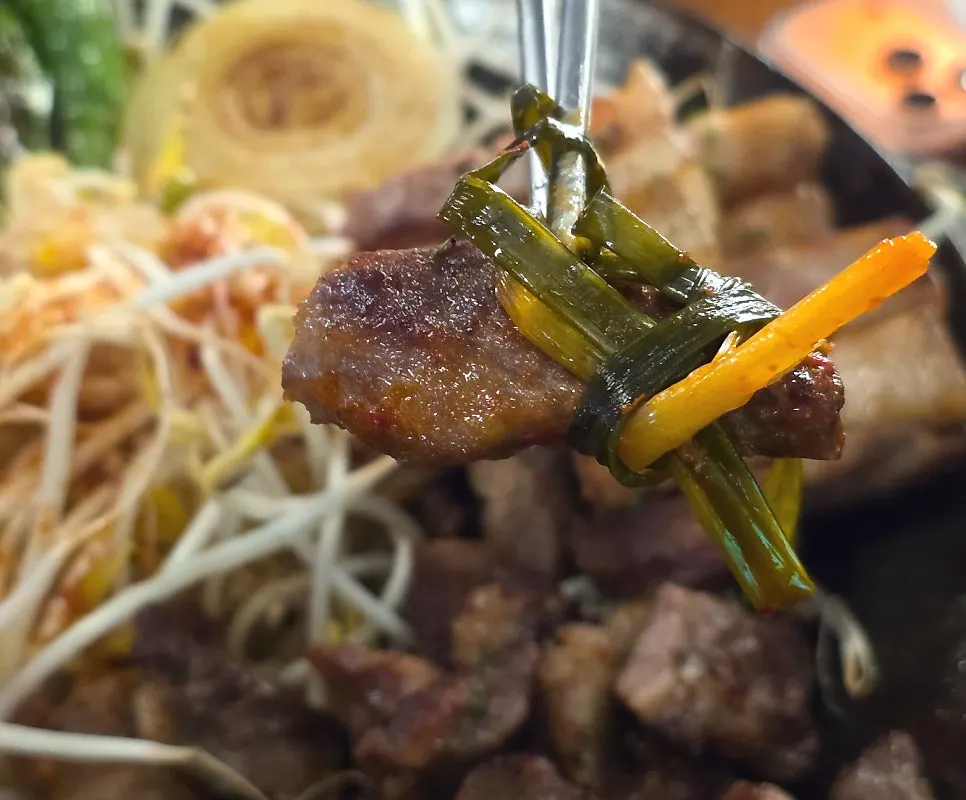 Chewy kkodeulsal and ppolsal grilling on the plate