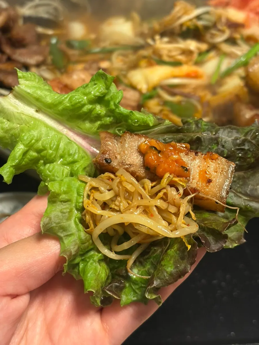 Wilted bean sprouts mixed with kimchi and seasoned chives