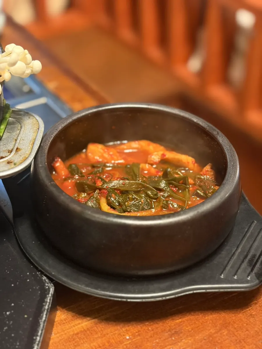Meat and vegetables dipped generously in sauce