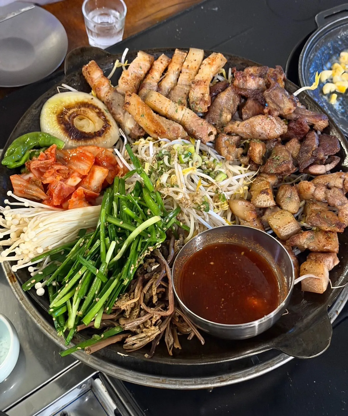 Assorted pork cuts grilled and served over charcoal