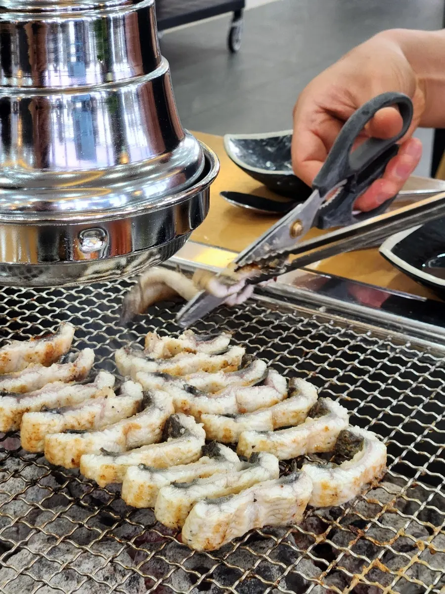 Eel grilling over charcoal