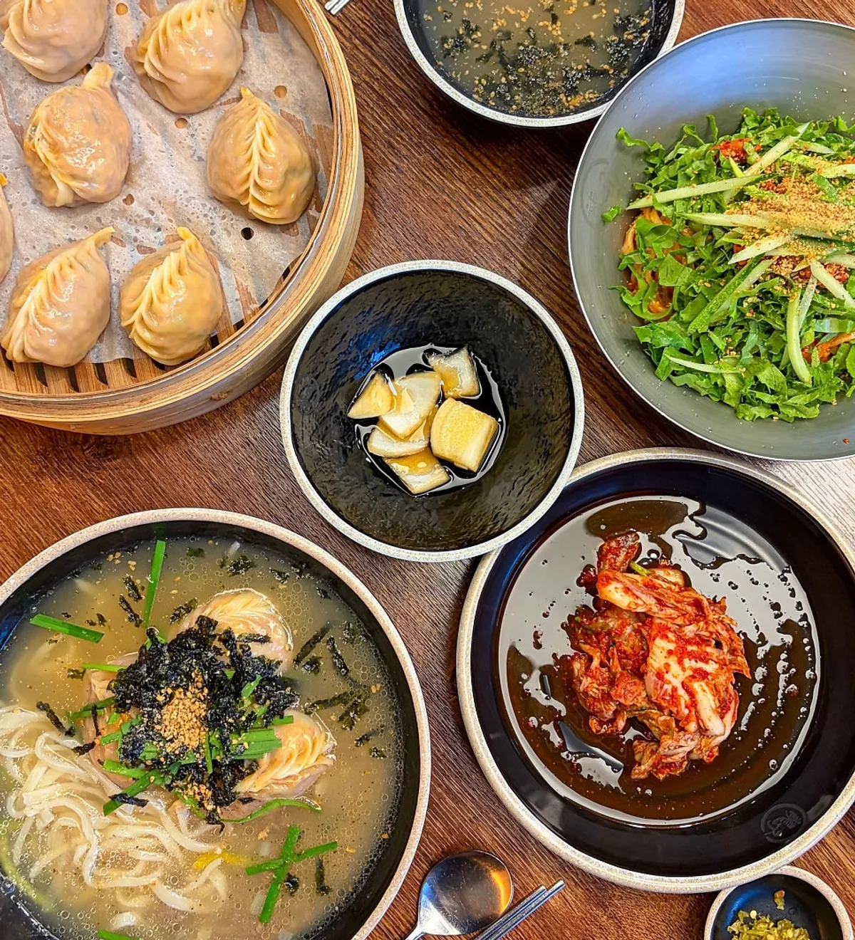Kimchi dumplings with pepper seasoning and pickled onions