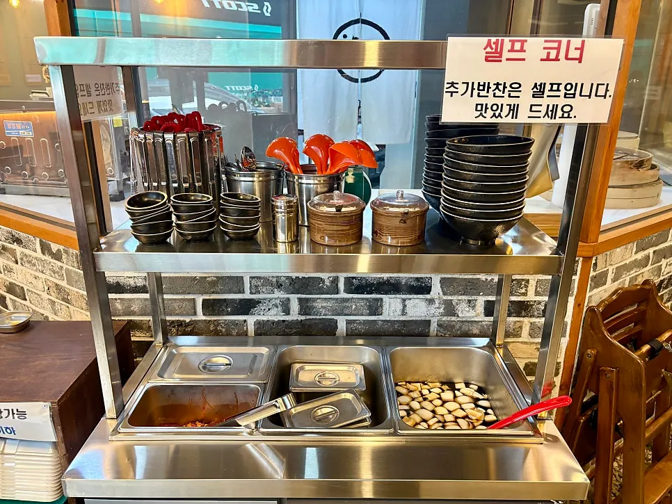 Dumpling-steaming area seen through a glass window