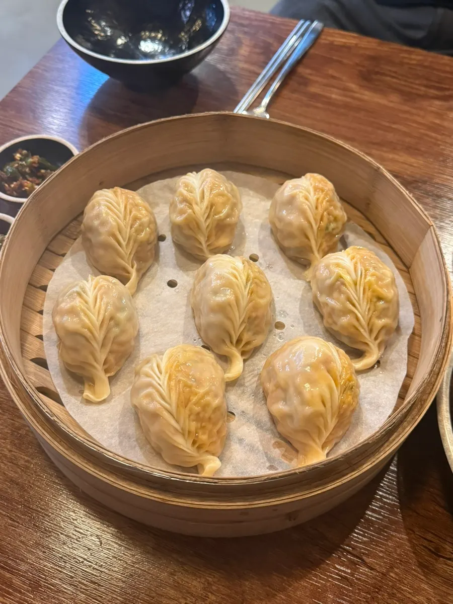 A full spread of kalguksu and steamed dumplings