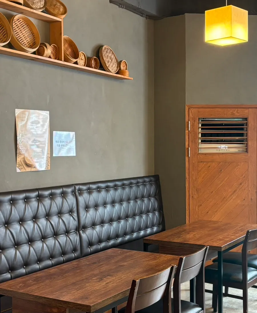 Interior of the kalguksu restaurant with a wood-tone design
