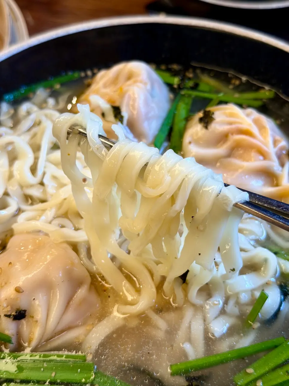Homemade noodles lifted from the dumpling kalguksu soup