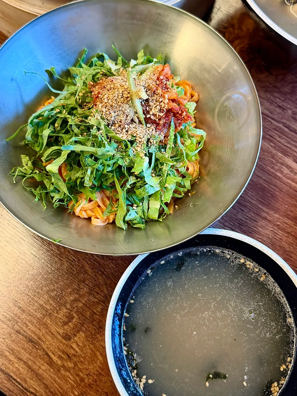 Bibim kalguksu topped with homemade sauce and vegetables