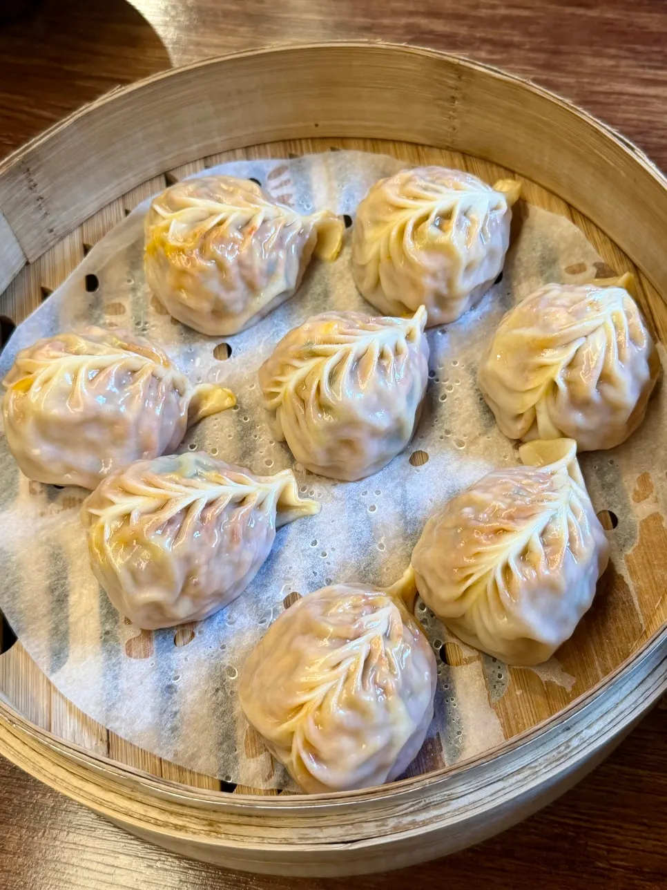 A plate of handmade steamed kimchi dumplings
