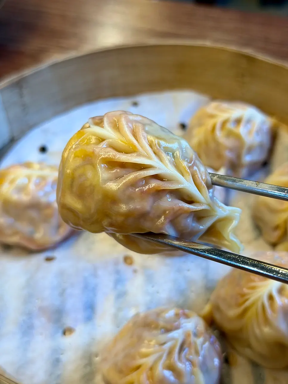 A cross-section of a kimchi dumpling packed with filling