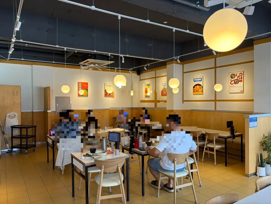 Dining space with bar seating and tables for two