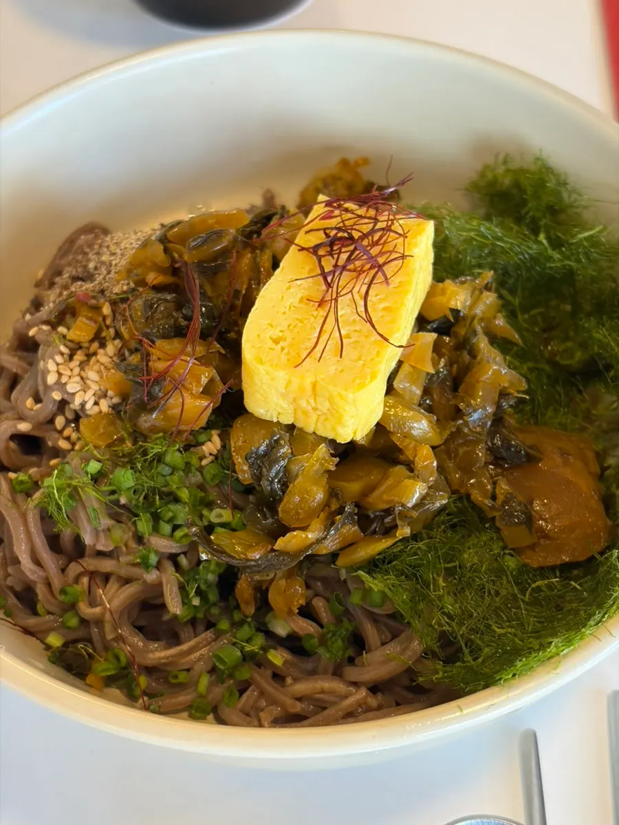 One piece of salmon futomaki filled with varied ingredients