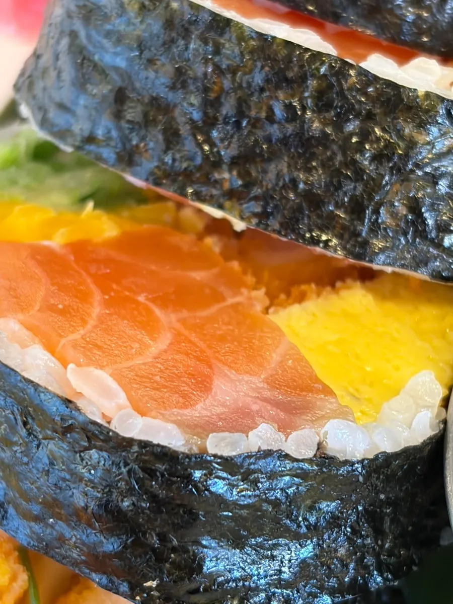 A meal enjoying futomaki and soba together